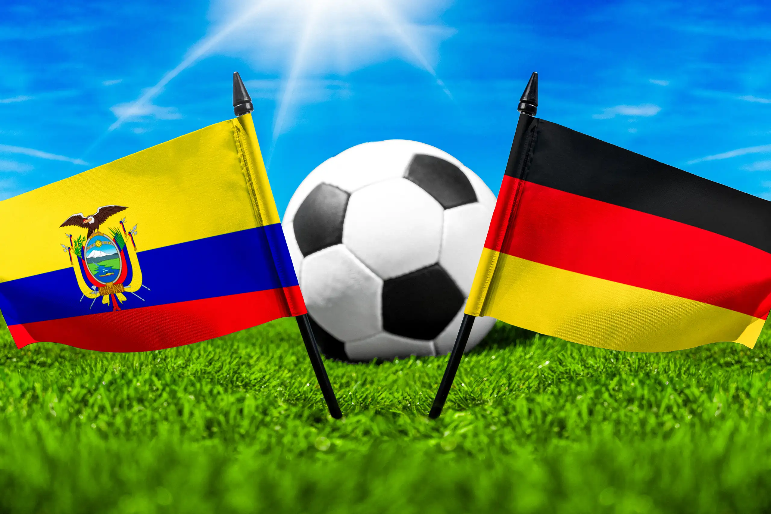 deutschland gegen ecuador fußball mit nationalflaggen und ball auf grünem spielfeld.