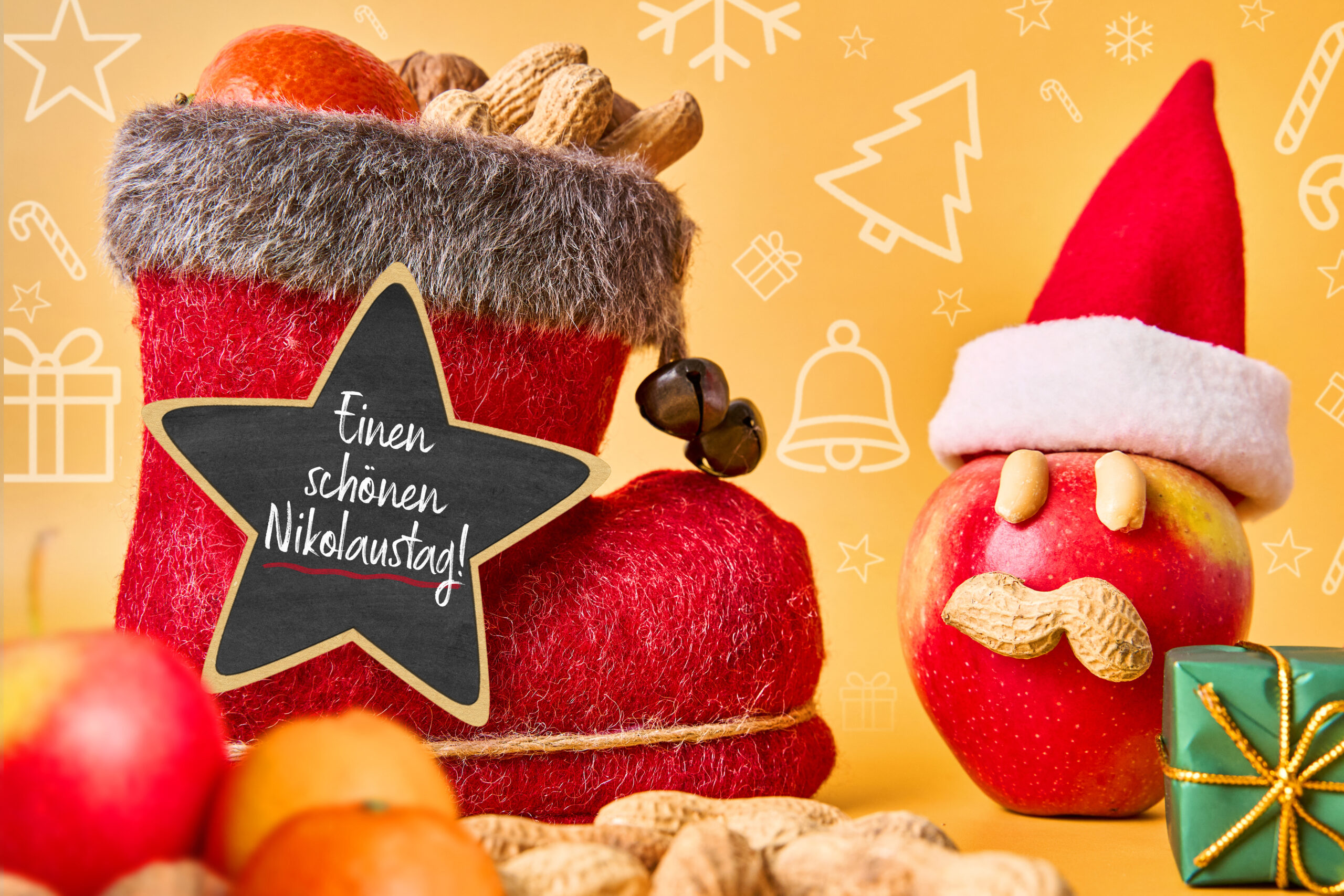 einen schönen nikolaustag – lustiger nikolausgruß mit stiefel, apfel und nüssen auf gelbem hintergrund