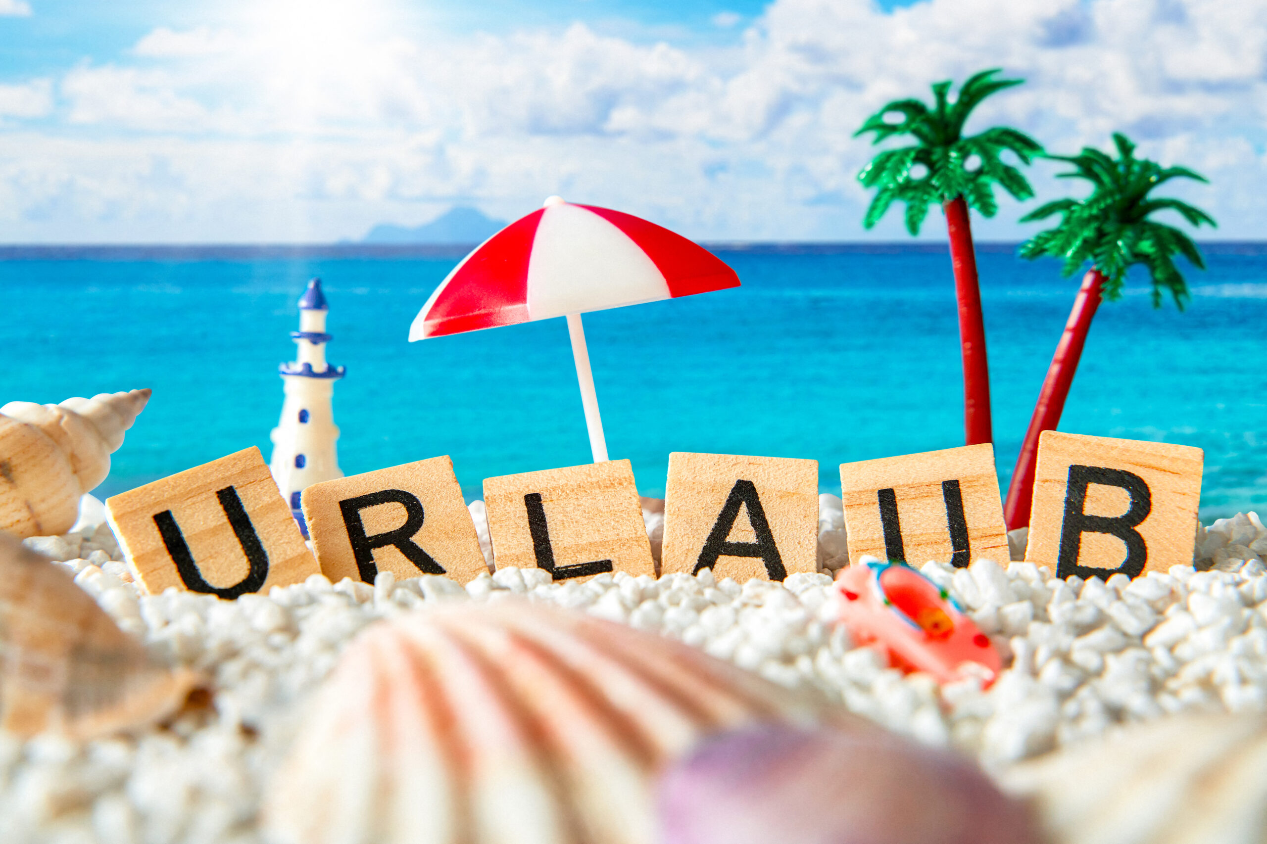urlaub schriftzug sand meer scaled